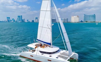 Luxury catamaran sailing in Miami waters with skyline view